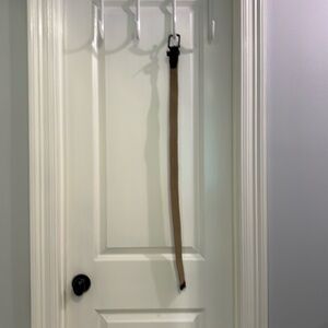 Nike g-flex belt. Tan and brown. Size small 34 in. Stretchy and comfortable.